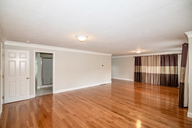 12 Kestrel Ln Unit 7, Westford, MA 01886 - spare room featuring light wood-style flooring, baseboards, and crown molding
