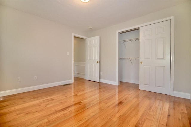 12 Kestrel Ln Unit 7, Westford, MA 01886 - unfurnished bedroom featuring light wood-style flooring, a closet, and baseboards