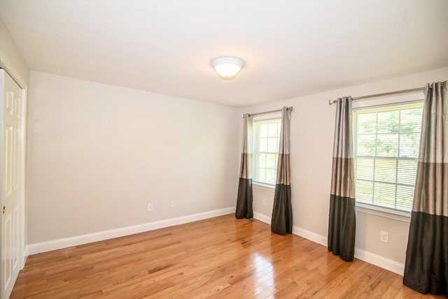 12 Kestrel Ln Unit 7, Westford, MA 01886 - spare room featuring healthy amount of natural light, light wood finished floors, and baseboards