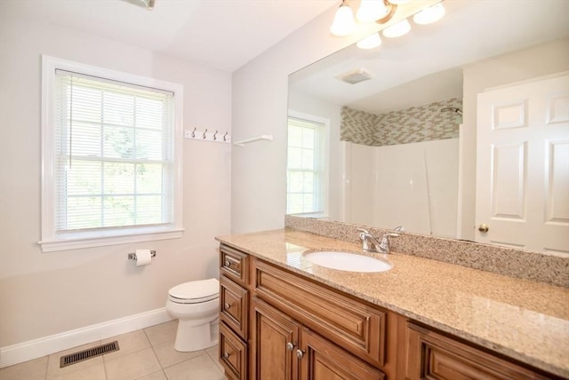 12 Kestrel Ln Unit 7, Westford, MA 01886 - bathroom featuring tile patterned flooring, baseboards, toilet, a shower, and vanity