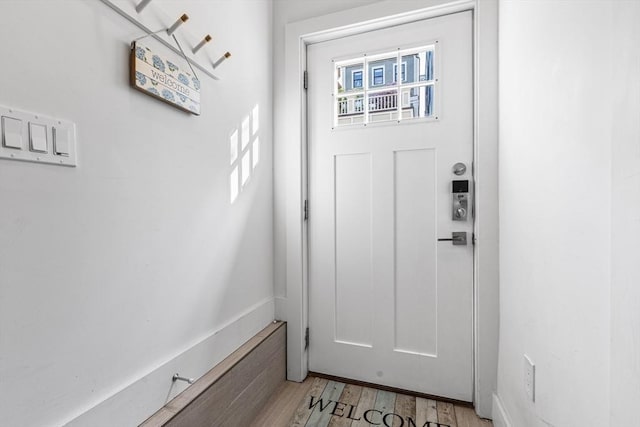 doorway to outside featuring light wood finished floors