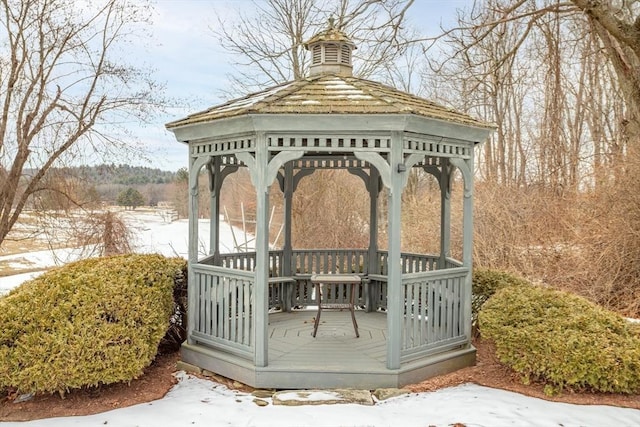 snow covered deck featuring a gazebo