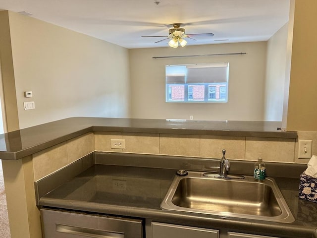 211 Central Unit A210, Norwood, MA 02062 - kitchen featuring dark countertops, a sink, ceiling fan, and decorative backsplash