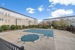 211 Central Unit A210, Norwood, MA 02062 - community pool featuring a patio