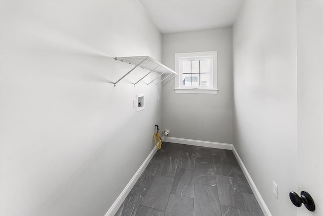 laundry room featuring washer hookup, laundry area, baseboards, and gas dryer hookup