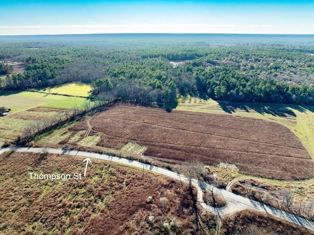 birds eye view of property with a rural view and a forest view