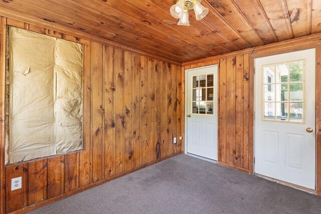 225 W Main St, Dudley, MA 01571 - carpeted spare room featuring wooden ceiling and wood walls
