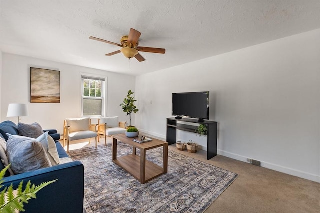 225 W Main St, Dudley, MA 01571 - living room featuring ceiling fan and carpet