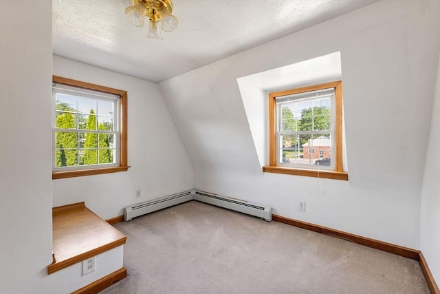 225 W Main St, Dudley, MA 01571 - additional living space with carpet flooring, lofted ceiling, and a baseboard heating unit