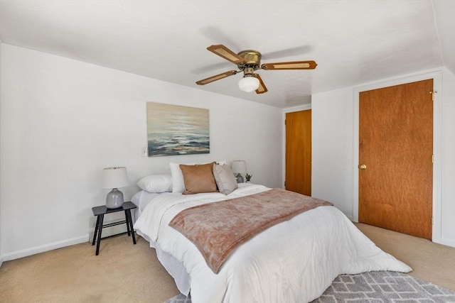 225 W Main St, Dudley, MA 01571 - bedroom with light colored carpet, a ceiling fan, and a baseboard radiator
