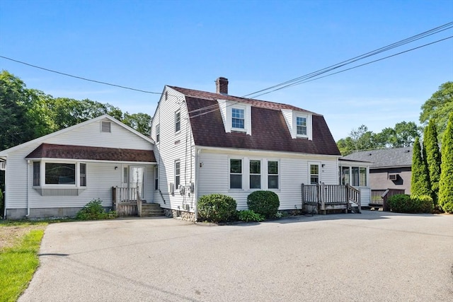 225 W Main St, Dudley, MA 01571 - colonial inspired home with a chimney, a gambrel roof, and a shingled roof