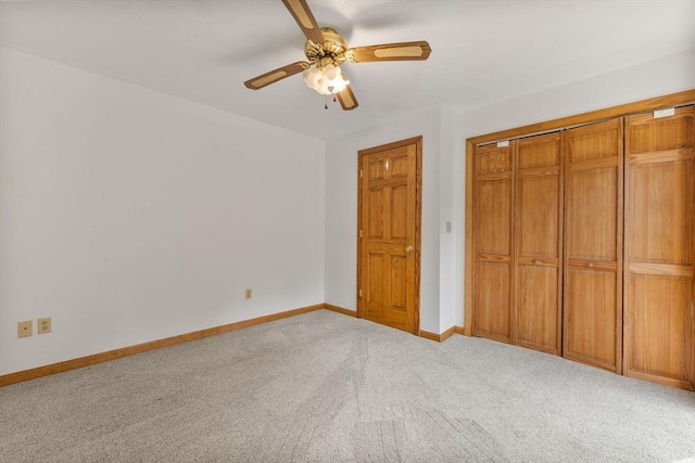 225 W Main St, Dudley, MA 01571 - unfurnished bedroom with light colored carpet, a closet, and a ceiling fan