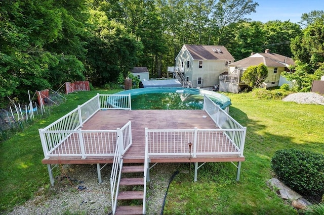 225 W Main St, Dudley, MA 01571 - rear view of house with a deck, a lawn, and stairway