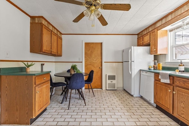 225 W Main St, Dudley, MA 01571 - kitchen featuring white appliances, brown cabinets, dark countertops, crown molding, and a ceiling fan
