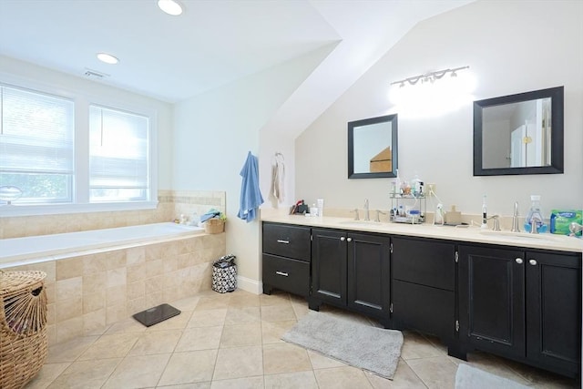 41 Webber St Unit 2, Malden, MA 02148 - bathroom with double vanity, tile patterned floors, a bath, vaulted ceiling, and recessed lighting