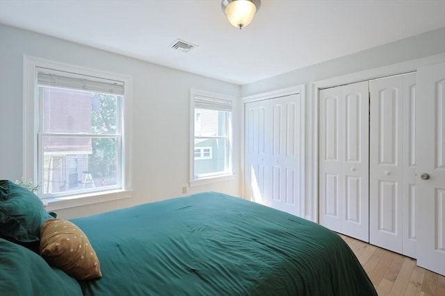 41 Webber St Unit 2, Malden, MA 02148 - bedroom featuring two closets and light wood finished floors