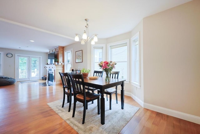 41 Webber St Unit 2, Malden, MA 02148 - dining area featuring a chandelier, light wood-style floors, a fireplace with flush hearth, and recessed lighting