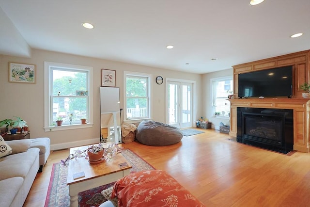 41 Webber St Unit 2, Malden, MA 02148 - living room featuring plenty of natural light, light wood-style floors, a fireplace with flush hearth, and recessed lighting