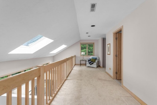 3 Dogwood Cir Unit 3, Franklin, MA 02038 - hall featuring a skylight, vaulted ceiling, carpet, and baseboards