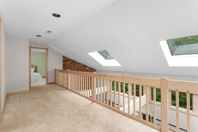 3 Dogwood Cir Unit 3, Franklin, MA 02038 - hallway with a skylight, lofted ceiling, carpet flooring, and baseboards