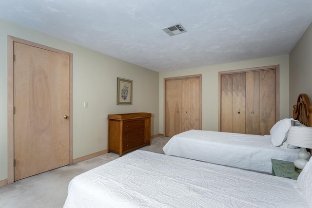 3 Dogwood Cir Unit 3, Franklin, MA 02038 - bedroom featuring light carpet, two closets, and baseboards