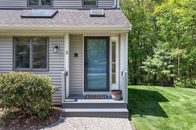 3 Dogwood Cir Unit 3, Franklin, MA 02038 - view of exterior entry featuring roof with shingles and a lawn