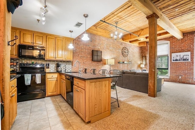 14 Sanford St Unit 21, Medway, MA 02053 - kitchen featuring black appliances, a sink, a peninsula, brick wall, and wood ceiling with exposed beams