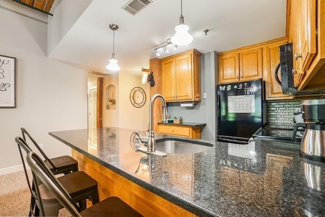 14 Sanford St Unit 21, Medway, MA 02053 - kitchen with black appliances, a sink, decorative light fixtures, and backsplash