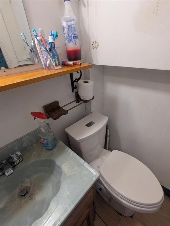 bathroom featuring vanity and toilet