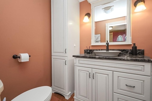 bathroom with tile patterned floors, toilet, and vanity