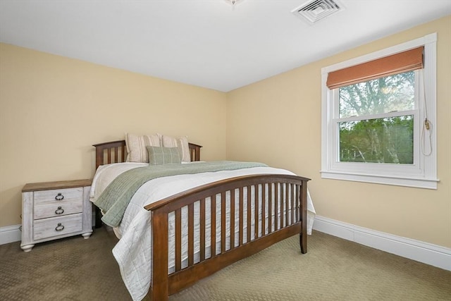 bedroom with baseboards, visible vents, and carpet floors