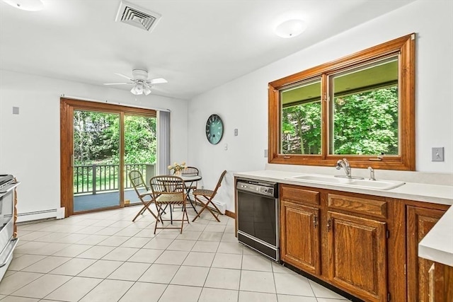 22 Grove Pl Unit 4, Winchester, MA 01890 - kitchen with black dishwasher, a sink, a baseboard radiator, a ceiling fan, and light countertops