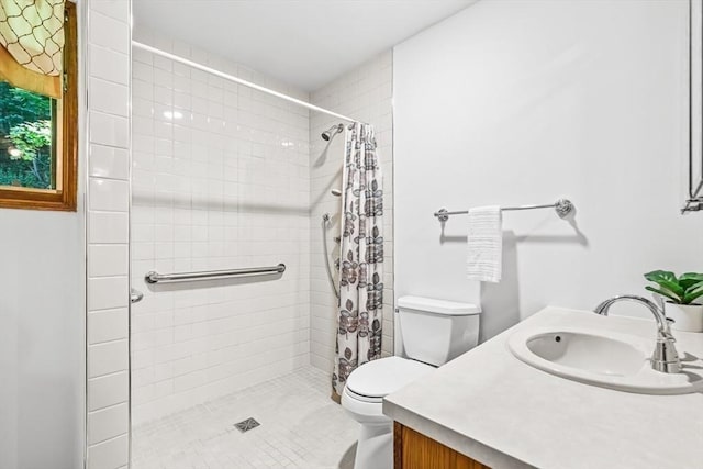 22 Grove Pl Unit 4, Winchester, MA 01890 - full bathroom featuring toilet, a tile shower, and vanity