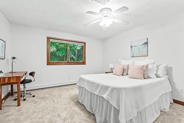 22 Grove Pl Unit 4, Winchester, MA 01890 - bedroom with light colored carpet, baseboards, baseboard heating, and an office area