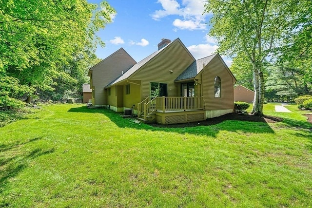 22 Grove Pl Unit 4, Winchester, MA 01890 - rear view of house with a deck, a chimney, a lawn, and central air condition unit