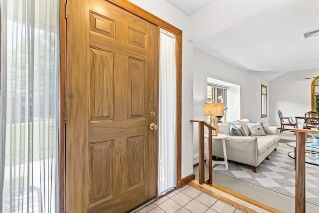 22 Grove Pl Unit 4, Winchester, MA 01890 - foyer entrance with light tile patterned flooring and baseboards