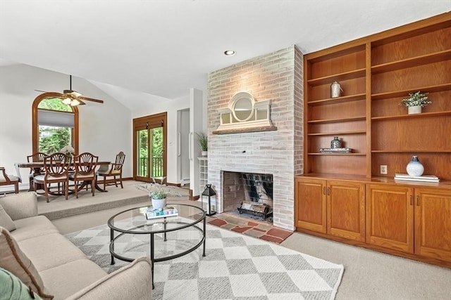 22 Grove Pl Unit 4, Winchester, MA 01890 - living area with light colored carpet, ceiling fan, a fireplace, lofted ceiling, and built in shelves