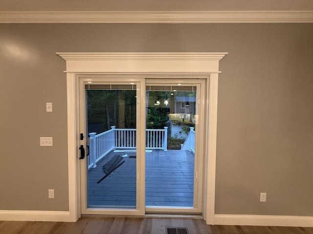 24 Cooper Rd, Webster, MA 01570 - doorway with baseboards, ornamental molding, and wood finished floors
