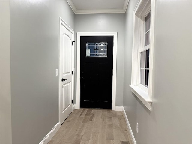 24 Cooper Rd, Webster, MA 01570 - doorway with ornamental molding, light wood finished floors, and baseboards