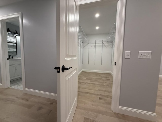 24 Cooper Rd, Webster, MA 01570 - spacious closet with light wood finished floors and a sink
