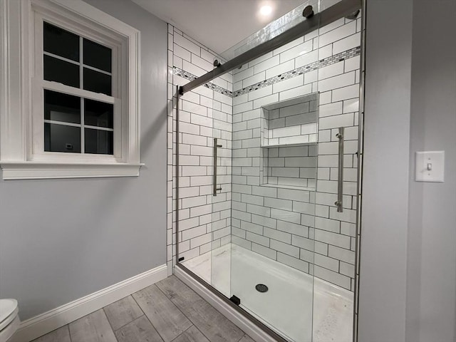 24 Cooper Rd, Webster, MA 01570 - full bathroom with a shower stall, baseboards, wood finished floors, and toilet