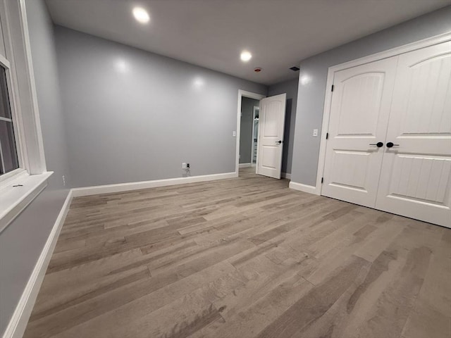 24 Cooper Rd, Webster, MA 01570 - unfurnished bedroom featuring light wood-style floors, recessed lighting, baseboards, and a closet