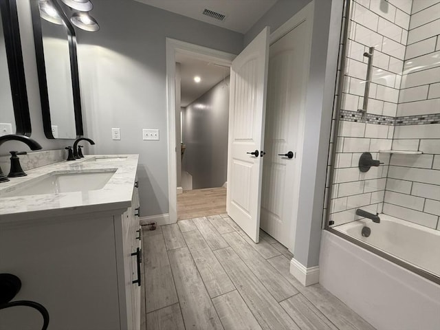 24 Cooper Rd, Webster, MA 01570 - full bathroom featuring vanity, wood finished floors, shower / washtub combination, and baseboards