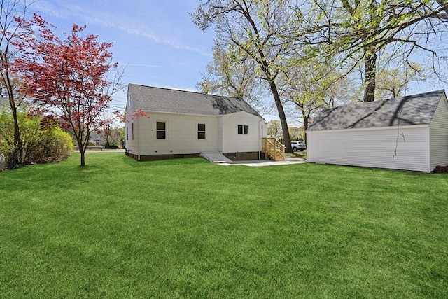 rear view of house featuring a yard