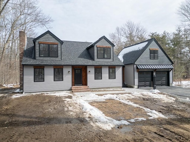 view of front of property with a garage, an outdoor structure, driveway, and a shingled roof