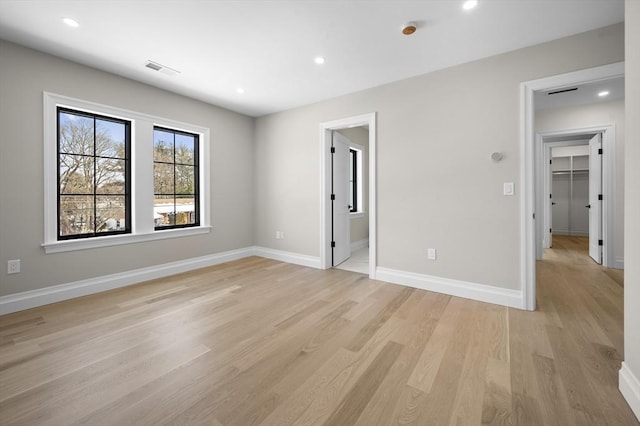 spare room featuring light wood-type flooring