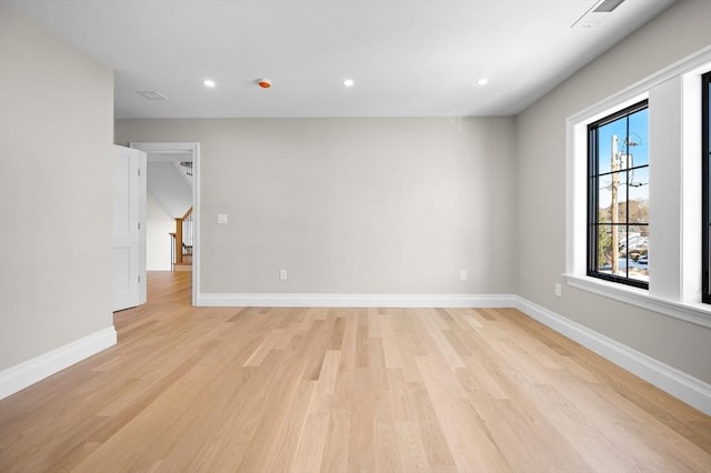 unfurnished room featuring light hardwood / wood-style flooring