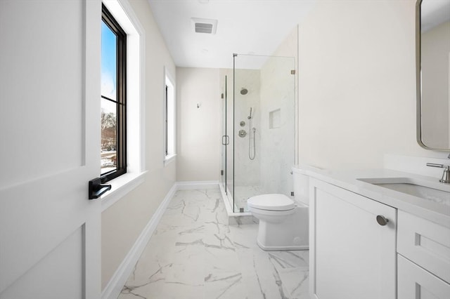 bathroom with vanity, an enclosed shower, and toilet