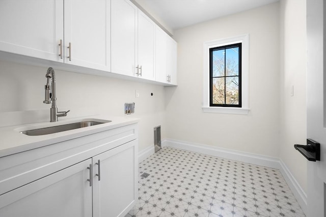 laundry room featuring cabinets, washer hookup, hookup for an electric dryer, and sink