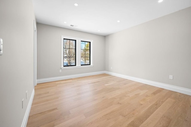 empty room with light hardwood / wood-style floors